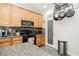 Well-equipped kitchen features granite counters, stainless appliances, and a convenient pantry at 6409 Dundock Ave, Las Vegas, NV 89122