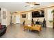 Spacious living room with tile floors, large TV, and a decorative ceiling at 6409 Dundock Ave, Las Vegas, NV 89122