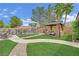 Lush backyard featuring a gazebo, an outdoor seating area, and a fence surrounding a sparkling pool at 7211 Heggie Ave, Las Vegas, NV 89131