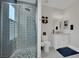 Stylish bathroom with a glass-enclosed shower, modern fixtures, and ample storage at 7211 Heggie Ave, Las Vegas, NV 89131