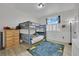 Cozy bedroom with bunk beds, modern decor, and a window offering natural light at 7211 Heggie Ave, Las Vegas, NV 89131