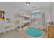 Bright bedroom featuring triple bunk beds, vanity, and natural light from the window at 7211 Heggie Ave, Las Vegas, NV 89131