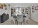 Elegant dining room with ample seating, wood-look floors, and stylish decor at 7211 Heggie Ave, Las Vegas, NV 89131