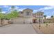 Inviting two-story home with a three-car garage, balcony and desert landscaping at 7211 Heggie Ave, Las Vegas, NV 89131