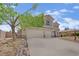 Charming two-story home with a three-car garage and well-maintained desert landscaping at 7211 Heggie Ave, Las Vegas, NV 89131