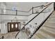 Grand foyer featuring a staircase, chandelier, and double front doors at 7211 Heggie Ave, Las Vegas, NV 89131