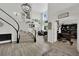 Elegant foyer with a staircase, high ceilings, wood floors, and open layout at 7211 Heggie Ave, Las Vegas, NV 89131
