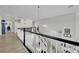 Second floor foyer with white staircase and black banister, offering open sightlines to other rooms at 7211 Heggie Ave, Las Vegas, NV 89131
