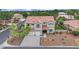 Elegant two-story home with a three-car garage and well-manicured front yard landscaping at 7211 Heggie Ave, Las Vegas, NV 89131