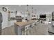 Bright kitchen with white cabinets, butcher block island, and modern appliances for culinary experiences at 7211 Heggie Ave, Las Vegas, NV 89131