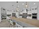 Modern kitchen with large center island, stainless steel appliances, and pendant lighting at 7211 Heggie Ave, Las Vegas, NV 89131