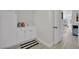 Convenient laundry area with a sink, white cabinetry, and modern appliances at 7211 Heggie Ave, Las Vegas, NV 89131