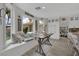Bright, open living area with breakfast nook, window seat, and wood-look flooring at 7211 Heggie Ave, Las Vegas, NV 89131