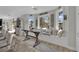 Bright, open living area with breakfast nook, window seat, and wood-look flooring at 7211 Heggie Ave, Las Vegas, NV 89131