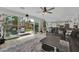 Open living room showcasing backyard access through sliding glass doors and neutral decor throughout at 7211 Heggie Ave, Las Vegas, NV 89131