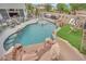 Beautiful backyard pool with rock features, slide, and seating area perfect for entertaining and relaxation at 7211 Heggie Ave, Las Vegas, NV 89131