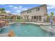 Amazing backyard oasis featuring a pool, rock waterfall, gazebo, and lush landscaping at 7211 Heggie Ave, Las Vegas, NV 89131
