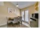 Cozy dining area with ceiling fan, stylish furnishings, and natural light at 7217 Mission Hills Dr, Las Vegas, NV 89113