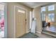Welcoming entryway with a stylish front door, sidelight window, and a glimpse into the bright living area at 7217 Mission Hills Dr, Las Vegas, NV 89113