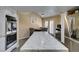 Bright kitchen featuring a large quartz countertop island, dining area, and stainless steel appliances at 7217 Mission Hills Dr, Las Vegas, NV 89113