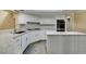 Modern kitchen with granite countertops, an island, and stainless steel appliances at 7217 Mission Hills Dr, Las Vegas, NV 89113