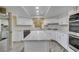 Contemporary kitchen with granite countertops, stainless steel appliances, and modern cabinetry at 7217 Mission Hills Dr, Las Vegas, NV 89113