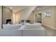 Bright living room with stone fireplace, modern lighting, and hardwood-style floors at 7217 Mission Hills Dr, Las Vegas, NV 89113
