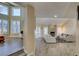 Open-concept living room boasts hardwood floors, ample lighting, and a stone fireplace at 7217 Mission Hills Dr, Las Vegas, NV 89113