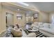Bright and spacious living room with skylight, an open floor plan, and stylish modern furniture at 7217 Mission Hills Dr, Las Vegas, NV 89113
