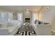 Sunlit living room with tiled fireplace and plantation shutters at 7217 Mission Hills Dr, Las Vegas, NV 89113
