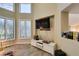 Bright living room boasting shuttered windows, a modern entertainment unit, and elegant decor at 7217 Mission Hills Dr, Las Vegas, NV 89113