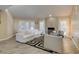 Comfortable living room featuring ample natural light, modern furniture, and a stylish fireplace at 7217 Mission Hills Dr, Las Vegas, NV 89113