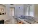 Comfortable living area featuring wood floors, modern furniture, and ample light at 7217 Mission Hills Dr, Las Vegas, NV 89113