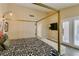 Bright main bedroom featuring a four-poster bed and ample natural light at 7217 Mission Hills Dr, Las Vegas, NV 89113
