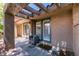 Comfortable covered patio space with textured concrete, providing a cozy outdoor living area at 7217 Mission Hills Dr, Las Vegas, NV 89113