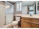 Full bathroom featuring a walk-in shower and vanity with storage at 725 Weatherstone Dr, Las Vegas, NV 89110