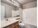 Bathroom featuring a single sink vanity and a bathtub with a shower at 725 Weatherstone Dr, Las Vegas, NV 89110