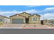Charming single-story home with a well-maintained front yard and a two-car garage at 7910 Pearly Ct, North Las Vegas, NV 89084