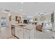 Spacious kitchen island with granite countertops that flows into a cozy living area at 7910 Pearly Ct, North Las Vegas, NV 89084