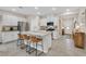 Bright, modern kitchen with a large island, stainless steel appliances, and ample cabinet space at 7910 Pearly Ct, North Las Vegas, NV 89084