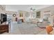 Open living area with a comfortable sofa, rug, and view to the dining room and kitchen at 7910 Pearly Ct, North Las Vegas, NV 89084