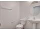Simple half bathroom with a modern sink, toilet, and neutral decor at 10220 Adobe Mountain St, Las Vegas, NV 89178