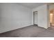 Spacious bedroom with gray carpet and a closet for ample storage space at 10220 Adobe Mountain St, Las Vegas, NV 89178