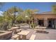 Outdoor picnic area with multiple tables surrounded by trees and community buildings at 10220 Adobe Mountain St, Las Vegas, NV 89178