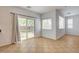 Open dining area with tile floors, sliding glass doors to the yard, and bright natural light at 10220 Adobe Mountain St, Las Vegas, NV 89178