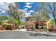 Well-maintained, two-story home with a two car garage and professional landscaping at 10220 Adobe Mountain St, Las Vegas, NV 89178