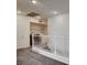 Hallway features white railing and a laundry area with appliances at 10220 Adobe Mountain St, Las Vegas, NV 89178