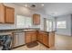 Bright kitchen with granite countertops, stainless steel appliances, and an adjacent dining area at 10220 Adobe Mountain St, Las Vegas, NV 89178