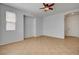 Spacious living room with tile floors, a large window, and ample space for customization at 10220 Adobe Mountain St, Las Vegas, NV 89178