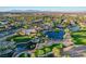 Stunning aerial view of the community, showcasing the lush landscaping, sparkling lakes, and resort-style amenities at 10562 Cerotto Ln, Las Vegas, NV 89135